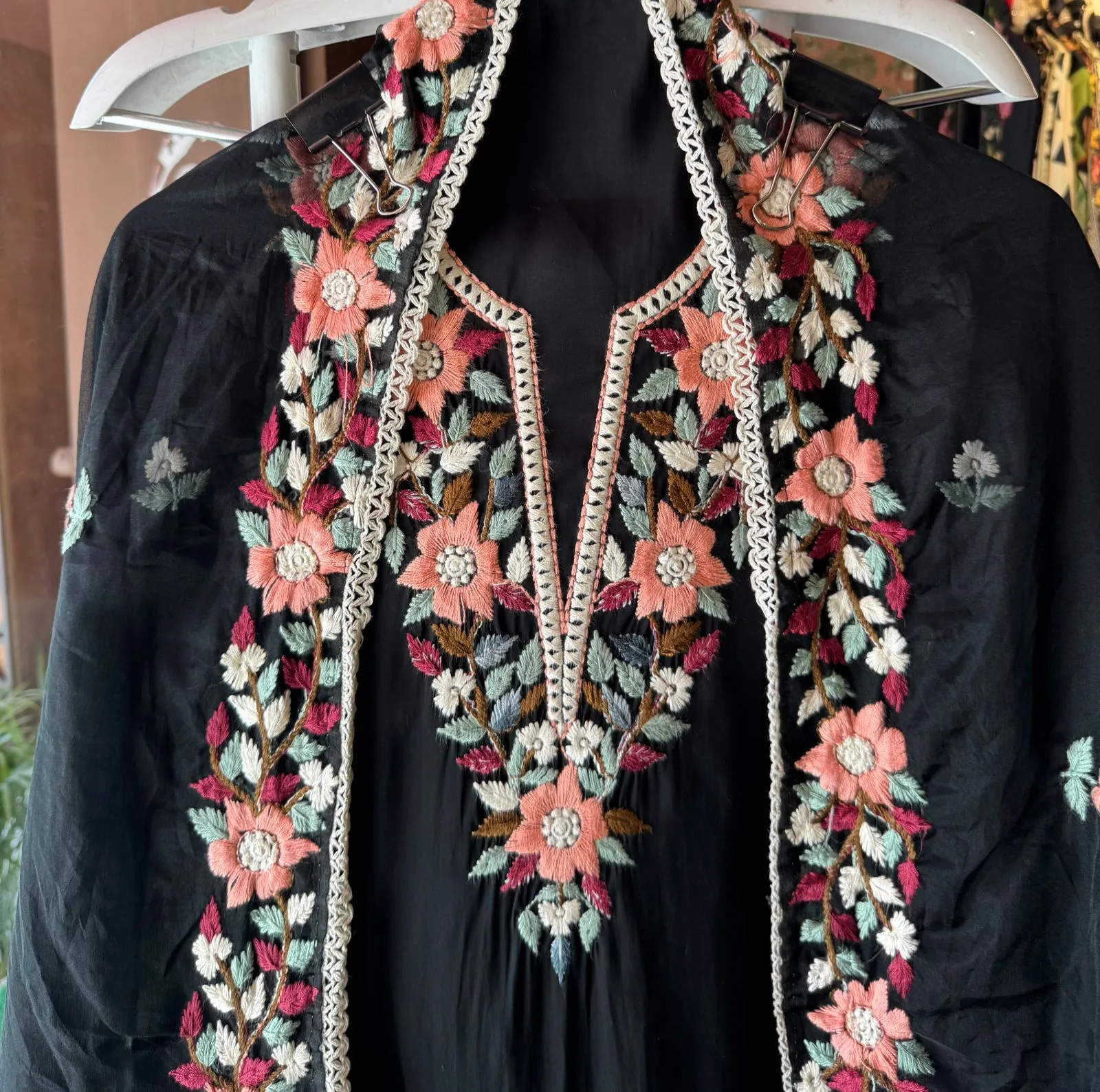 Soft cotton muslin shirt with thread embroidery done on the neckline  And booties on the shirt